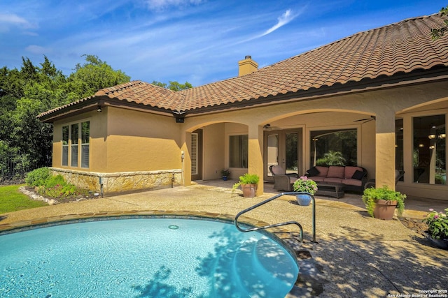 view of swimming pool with an outdoor hangout area and a patio