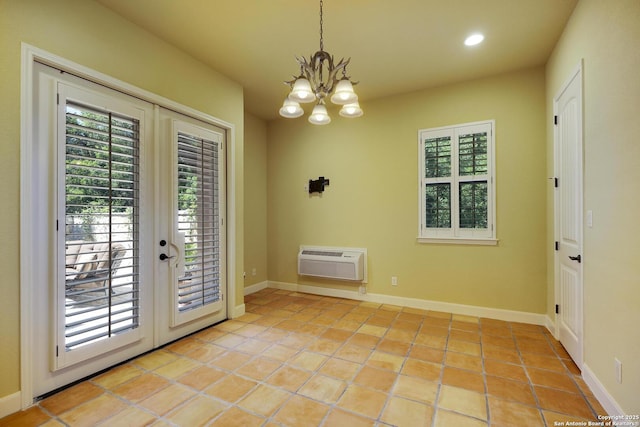 doorway to outside featuring a wall mounted air conditioner, a chandelier, light tile patterned floors, and french doors