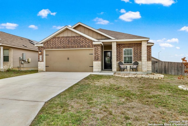 view of front of property featuring a front yard and a garage