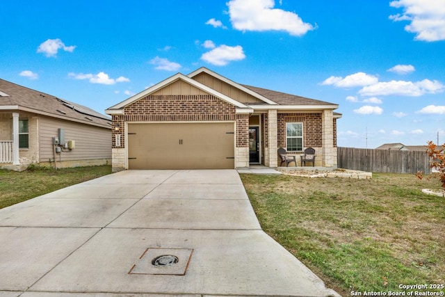 view of front of property featuring a garage and a front yard