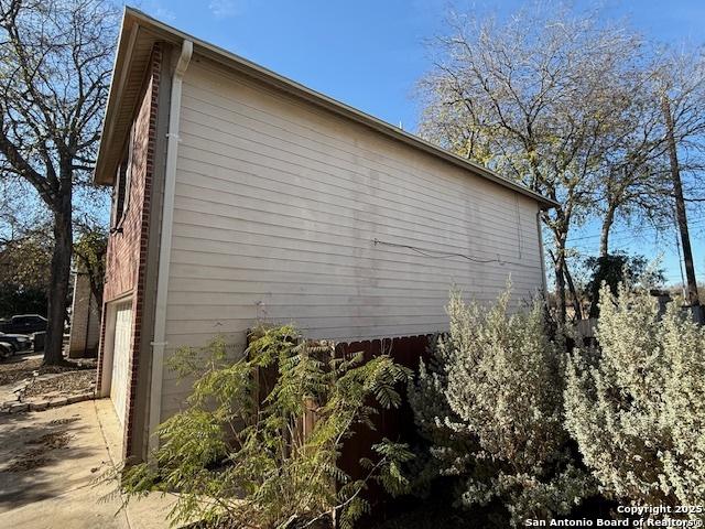 view of side of property with a garage