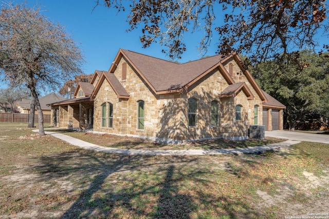 view of front of property featuring a garage and a front yard