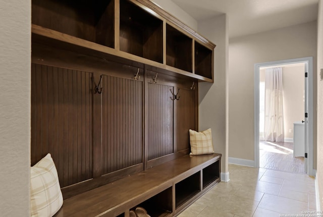 mudroom with light tile patterned flooring