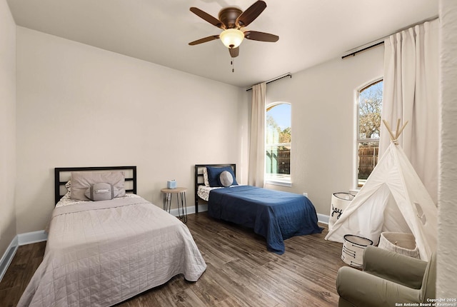 bedroom with hardwood / wood-style flooring and ceiling fan