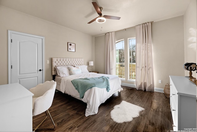 bedroom with ceiling fan and dark hardwood / wood-style floors