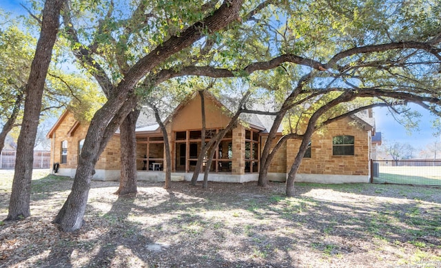 back of property featuring a sunroom