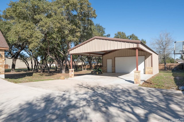 view of front of property with an outbuilding, a garage, and a carport