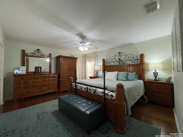 bedroom featuring dark hardwood / wood-style floors and ceiling fan