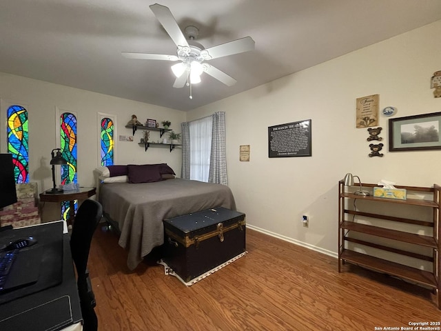 bedroom featuring hardwood / wood-style flooring and ceiling fan