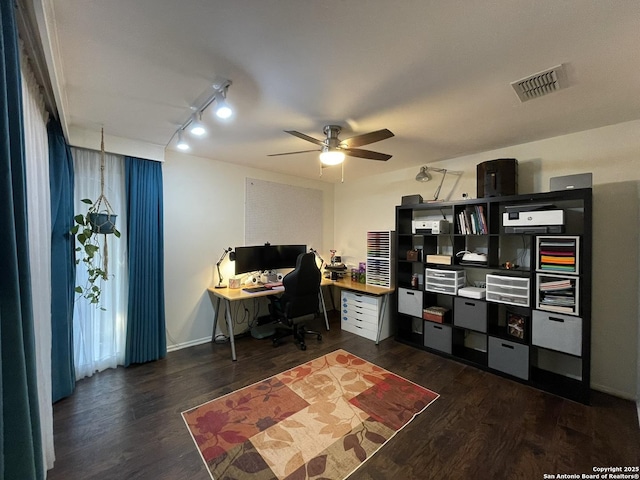 office space with ceiling fan, track lighting, and dark hardwood / wood-style flooring