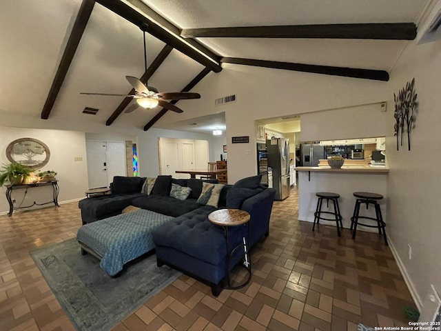 living room featuring vaulted ceiling with beams and ceiling fan