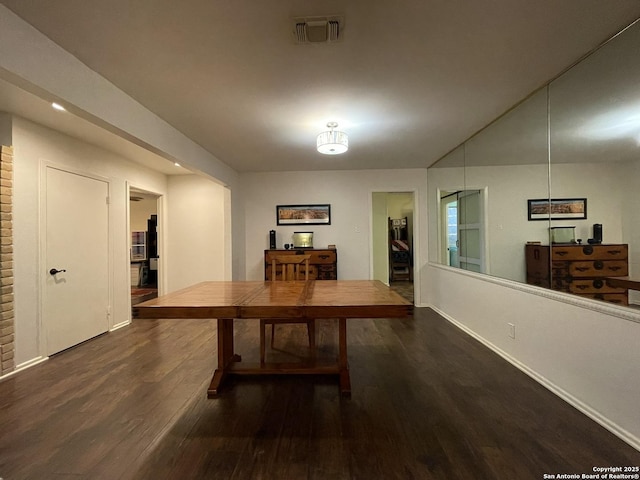 dining area with dark hardwood / wood-style floors