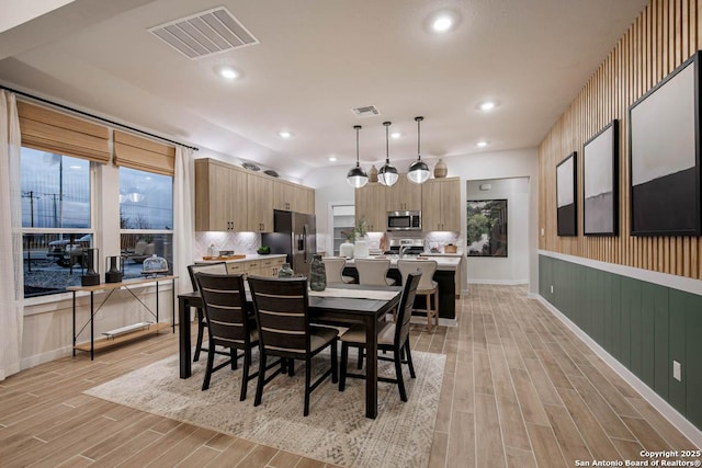 dining area with light hardwood / wood-style flooring