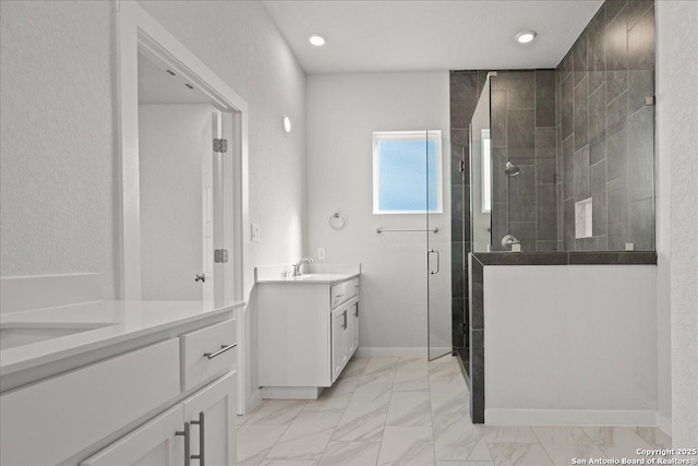 bathroom with vanity and walk in shower