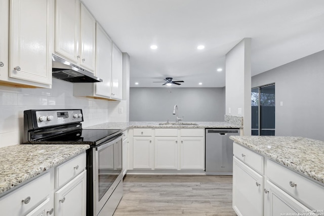 kitchen featuring white cabinets, appliances with stainless steel finishes, and sink