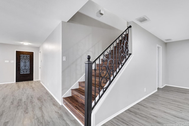 entryway with light hardwood / wood-style flooring