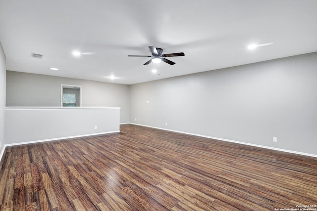 unfurnished room with dark hardwood / wood-style floors and ceiling fan