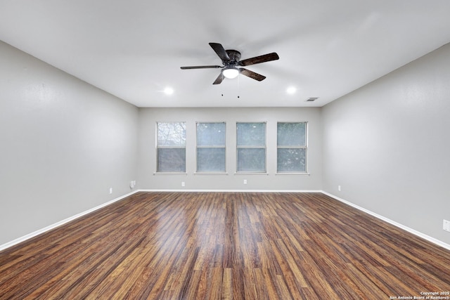 empty room with ceiling fan and wood-type flooring