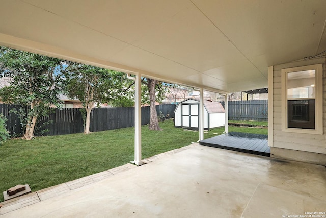 view of patio / terrace featuring a storage unit