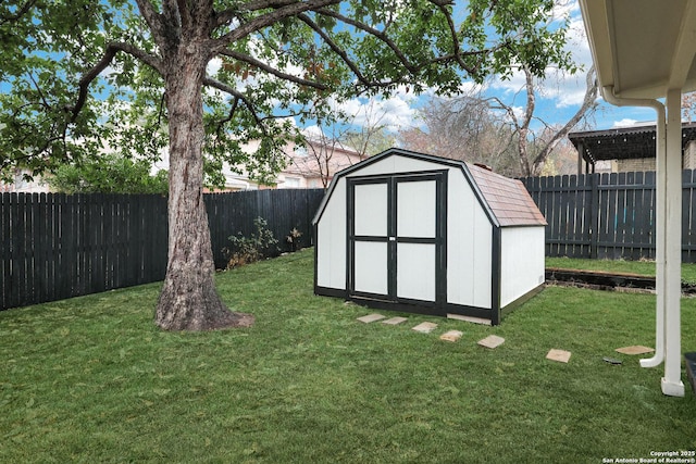 view of outbuilding with a lawn