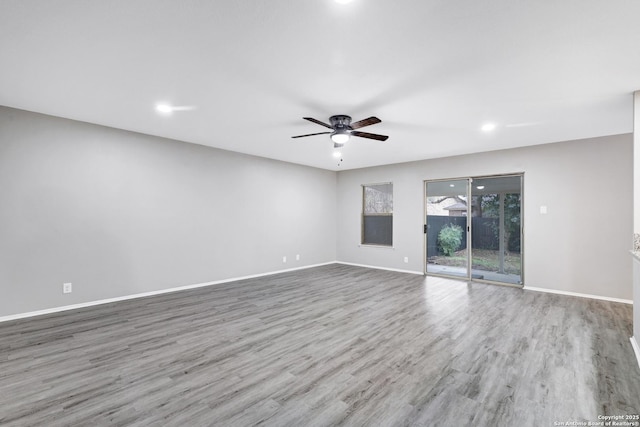 empty room with light hardwood / wood-style floors and ceiling fan