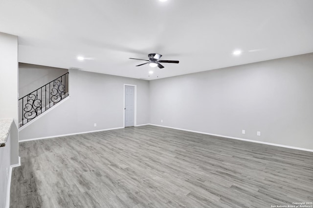 spare room featuring hardwood / wood-style floors and ceiling fan