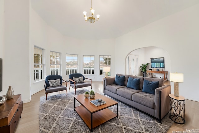 living room featuring a chandelier and hardwood / wood-style flooring