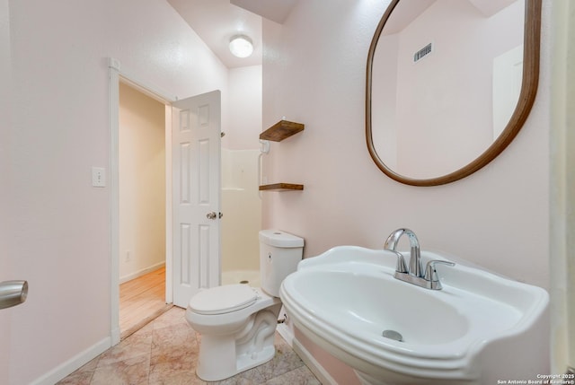 bathroom featuring sink and toilet