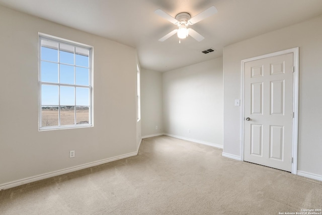 carpeted empty room with ceiling fan