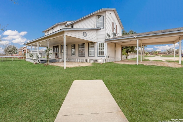 back of property featuring a porch, a patio area, and a yard