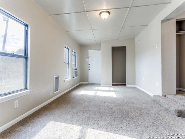 empty room with carpet and a healthy amount of sunlight