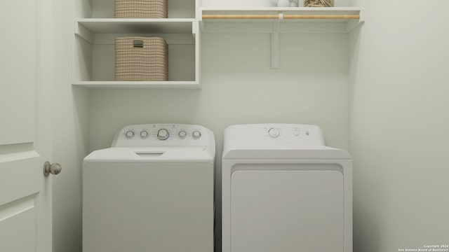 laundry room featuring washing machine and clothes dryer