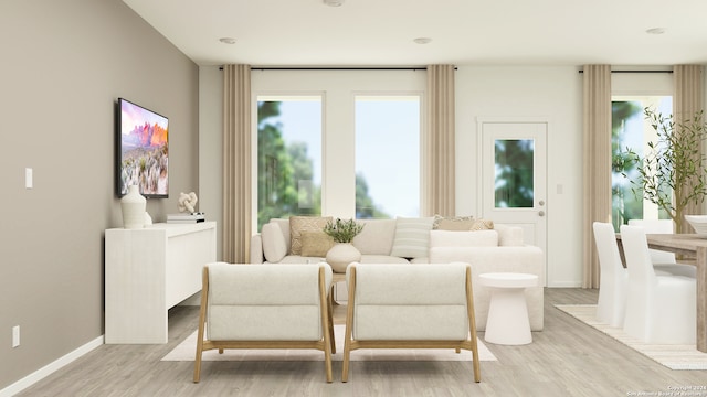 living area with light hardwood / wood-style flooring and plenty of natural light