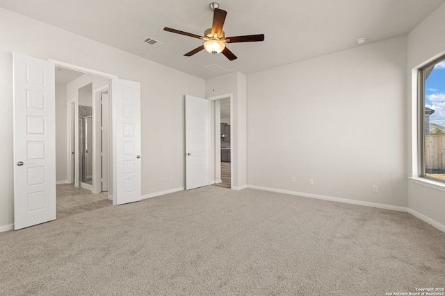 unfurnished bedroom featuring light carpet and ceiling fan