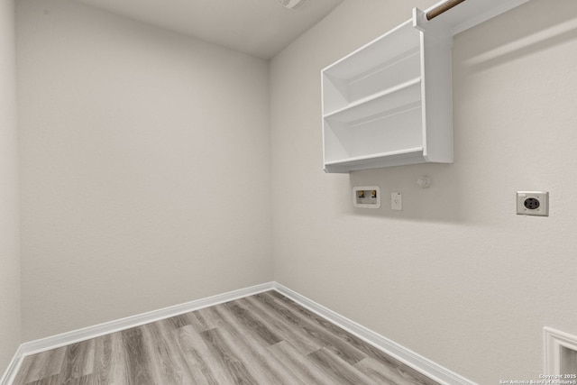 laundry room with gas dryer hookup, washer hookup, hookup for an electric dryer, and light hardwood / wood-style flooring