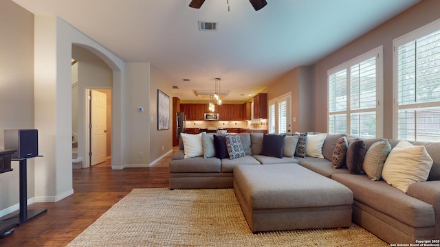 living room with hardwood / wood-style flooring and ceiling fan