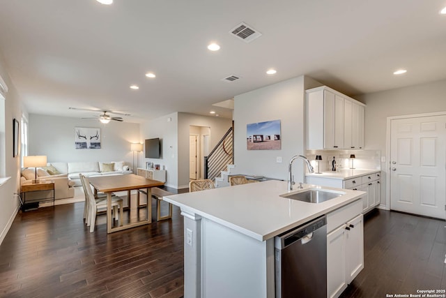 kitchen featuring sink, stainless steel dishwasher, ceiling fan, dark hardwood / wood-style floors, and white cabinetry