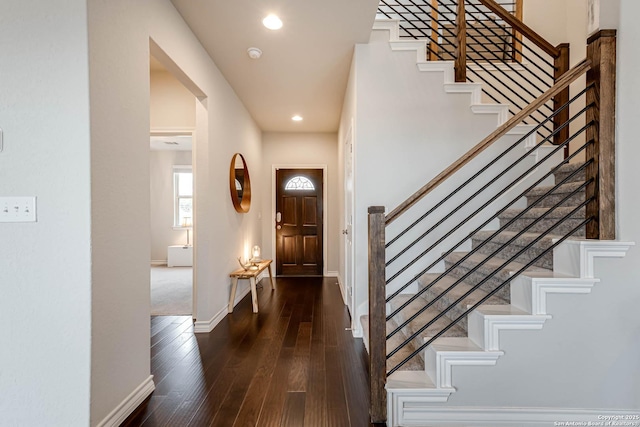 foyer with dark wood-type flooring