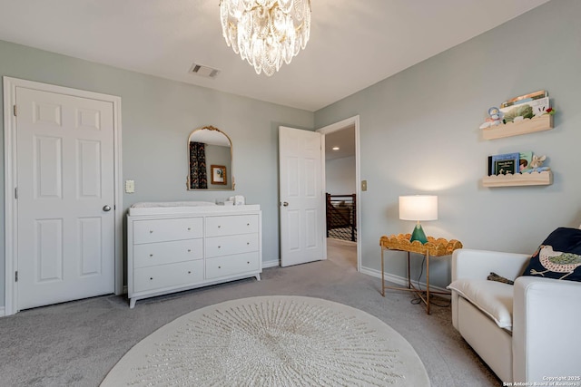 living area featuring a notable chandelier and light colored carpet