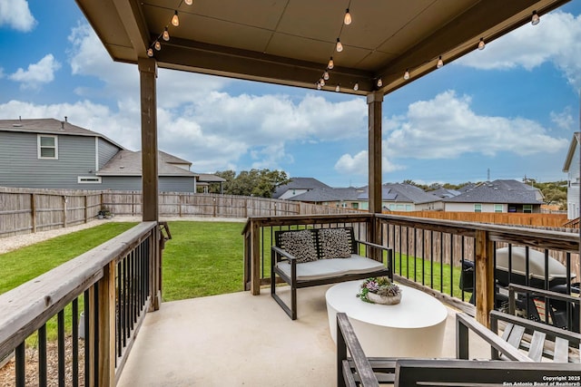 balcony with an outdoor hangout area and a patio area