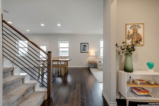 staircase with hardwood / wood-style flooring