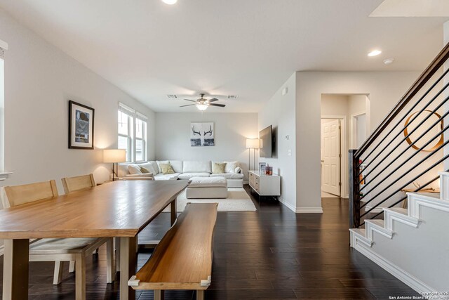 dining room featuring ceiling fan and dark hardwood / wood-style flooring