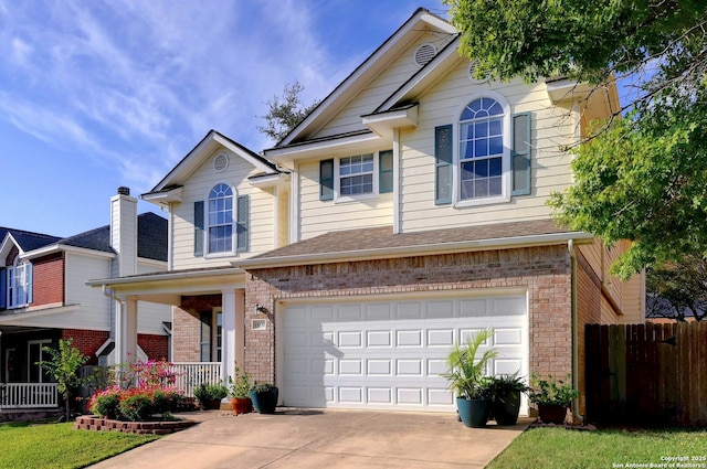 view of front of house with a garage and a porch