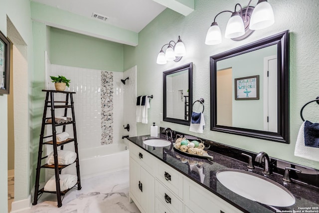 bathroom with beam ceiling, vanity, and  shower combination