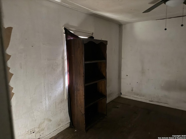 interior space featuring ceiling fan