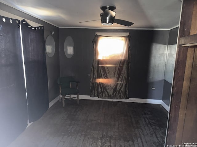 interior space featuring hardwood / wood-style floors, ceiling fan, and ornamental molding