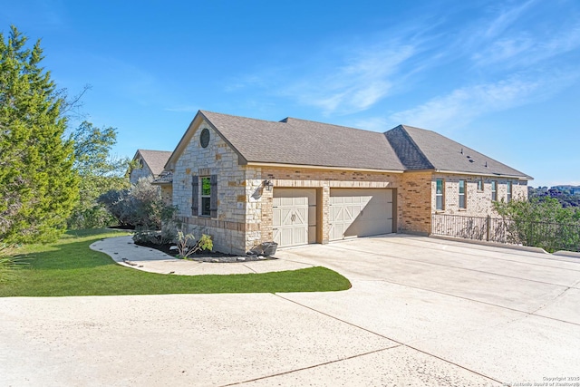 view of property exterior featuring a lawn and a garage