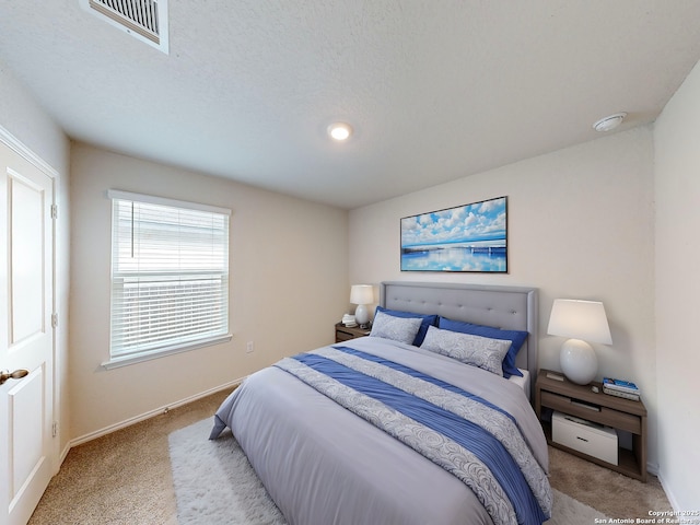 bedroom featuring light colored carpet