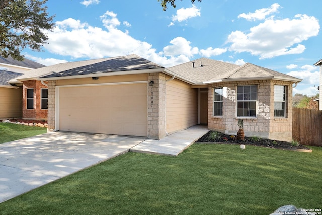 single story home featuring a garage and a front yard