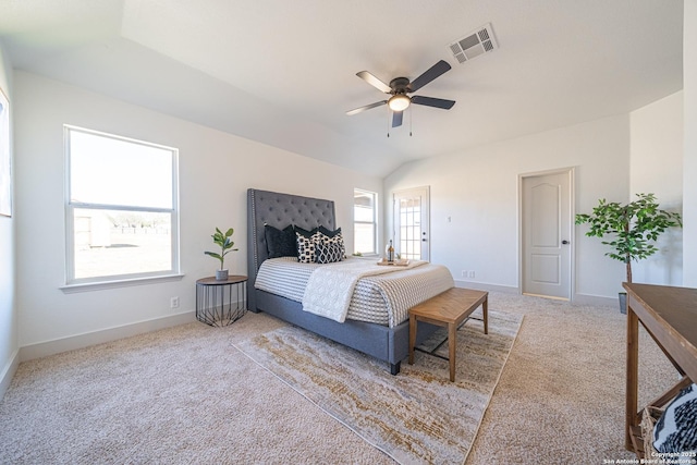 carpeted bedroom featuring ceiling fan and vaulted ceiling